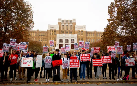 Parents, Kids, and Educators on strike in front of school