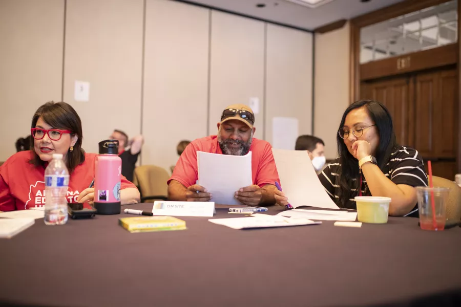 Three teachers sitting at a table